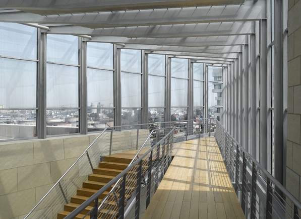 Haifa Supreme Court — glazed upper walkway with fritted screening and the city spread out beyond