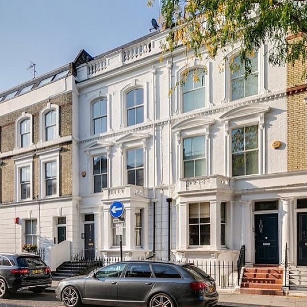 Ifield Road, Chelsea — white stucco Victorian terrace facade with arched sash windows and moulded cornices