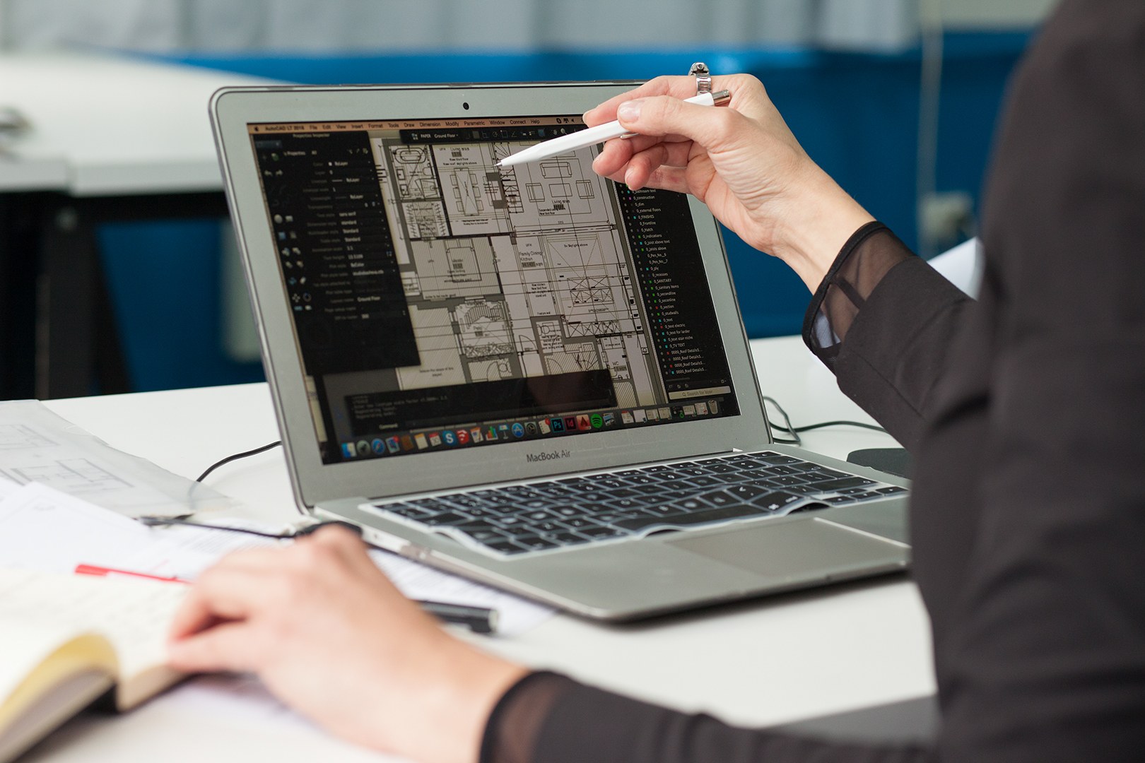 Kathy Basheva reviewing digital architectural drawings on a laptop at Studio Basheva